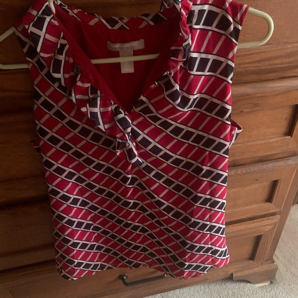 Cute red black and white print sleeveless blouse